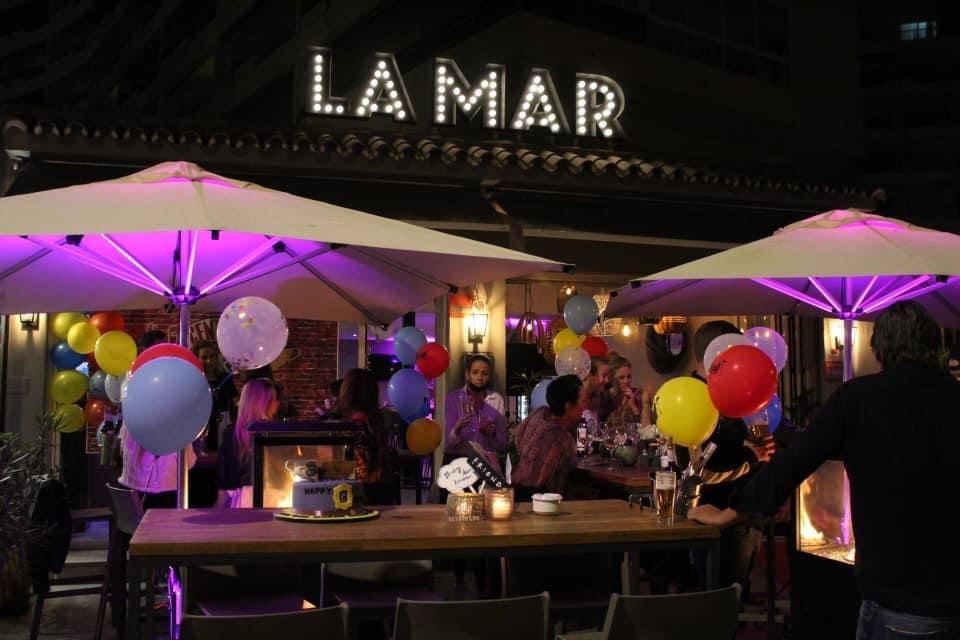 La Mar terrace lit up at night